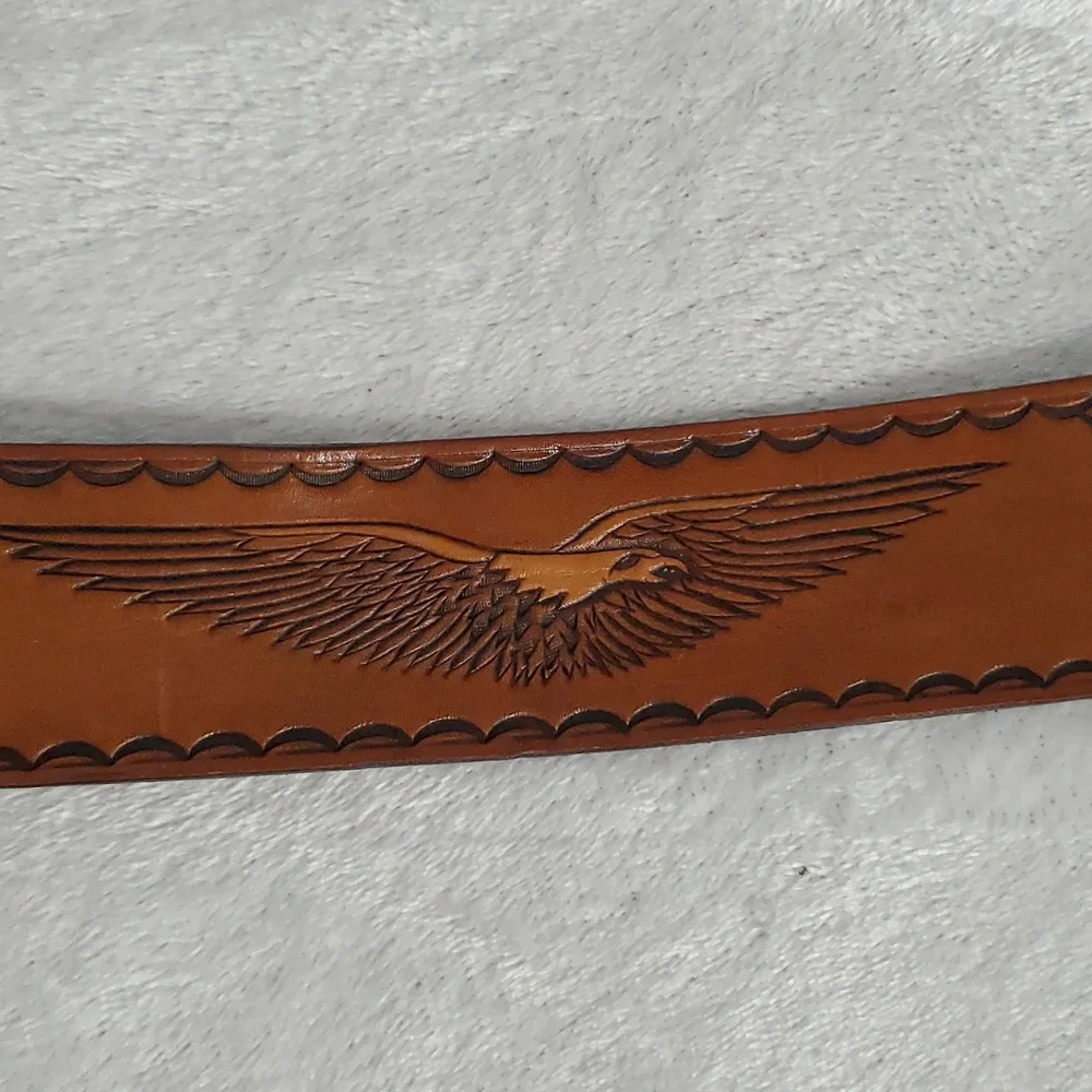 Vintage Leather Belt With Eagle Buckle and Details Embossed Along the Strap.